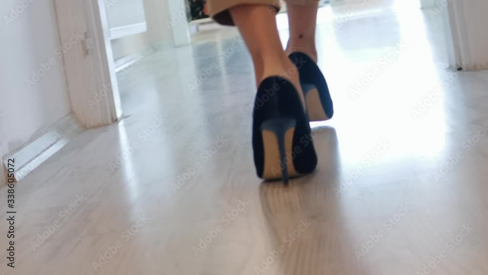 Woman walking with heeled shoes Woman walking with heeled shoes