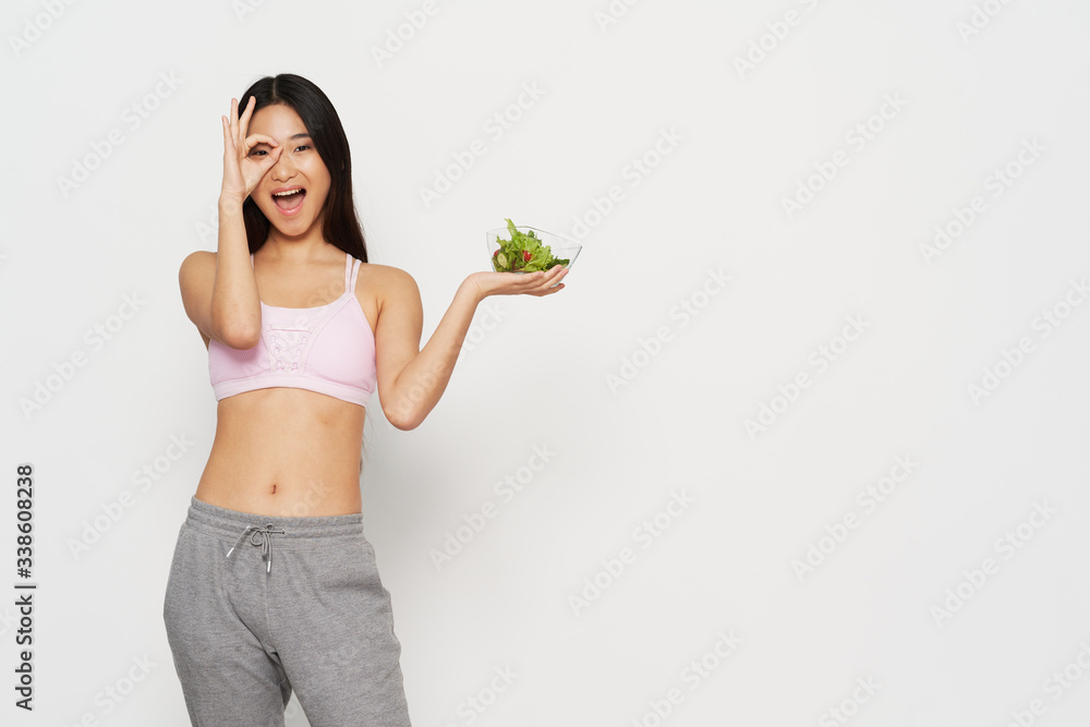 young woman holding a salad young woman holding a salad
