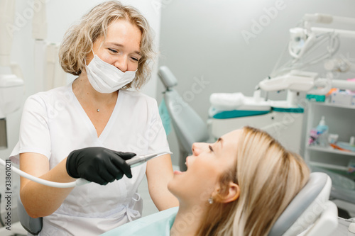 medical dentist procedure of teeth polishing with clean