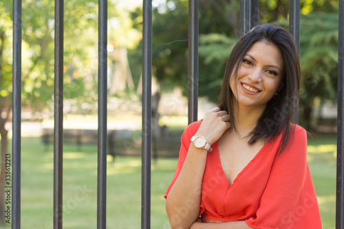 Model woman looking at camera during outdoors session