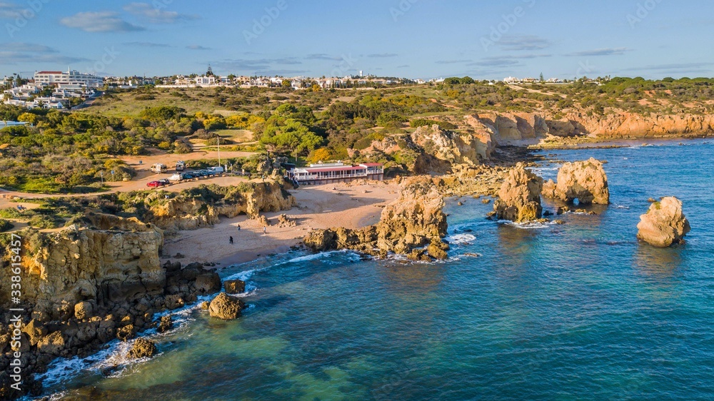 Aerial view of Arrifes beach, in Albufeira. Beautiful beach between the cliffs of the Algarve in Portugal
