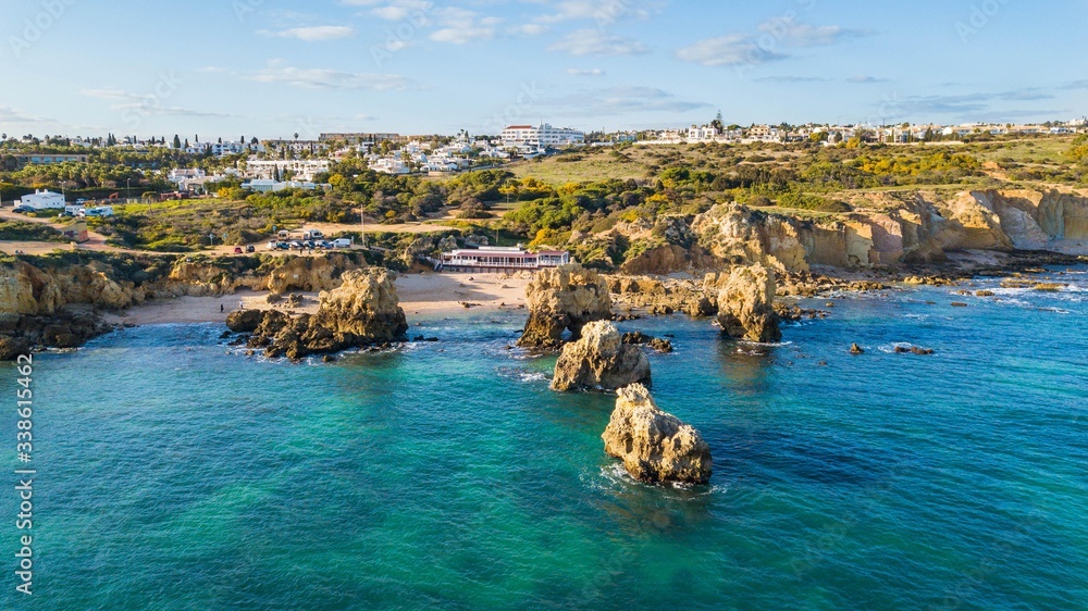 Aerial view of Arrifes beach, in Albufeira. Beautiful beach between the cliffs of the Algarve in Portugal
