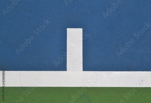 Tennis court at base line mark, close up, aerial view.