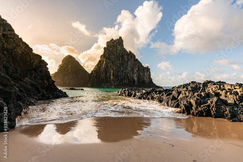 Beautiful Sunset at Cacimba do Padre beach with the view of Dois Irmaos Hill and turquoise clear water, at Fernando de Noronha, Unesco World Heritage site, Pernambuco, Brazil