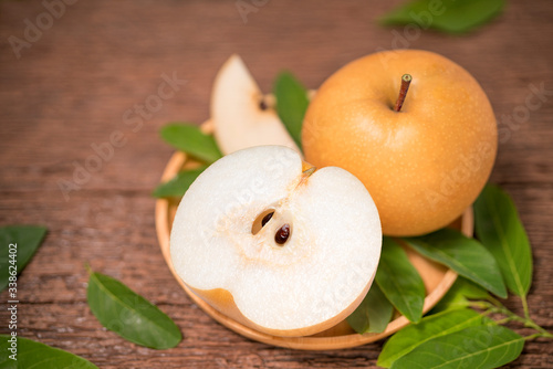 Snow pear or Korean pear on a wooden background, Nashi pear fruits delicious and sweet on wooden background photo