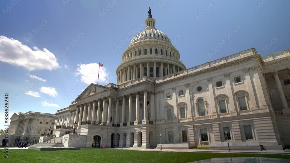 Wide angle motion of the US Capitol in Washington, DC on a beautiful sunny day. Wide angle motion of the US Capitol in Washington, DC on a beautiful sunny day.