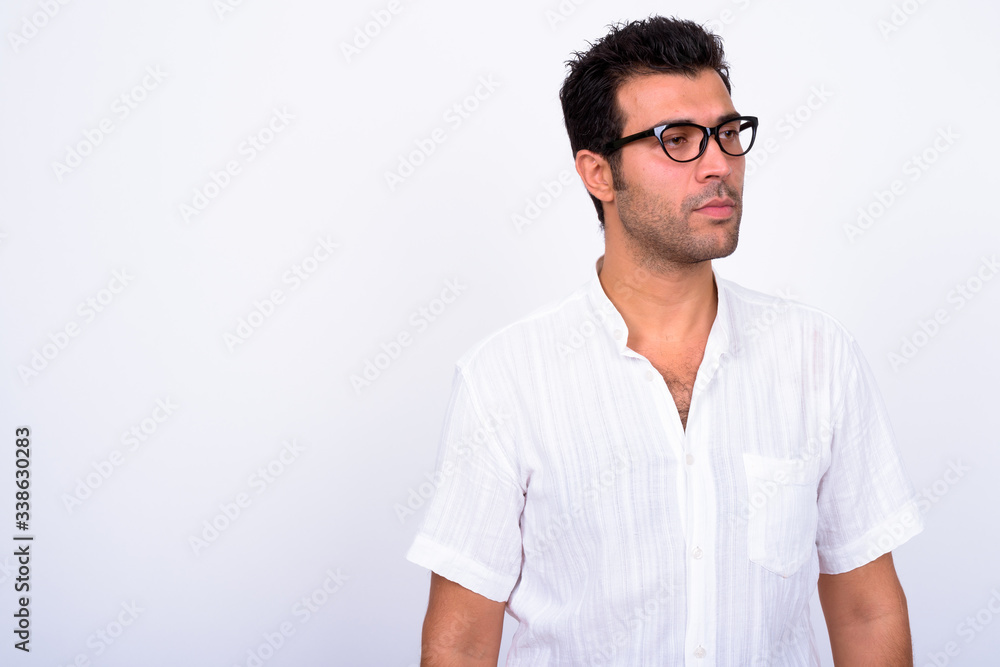 Portrait of handsome Turkish man with eyeglasses thinking Portrait of handsome Turkish man with eyeglasses thinking