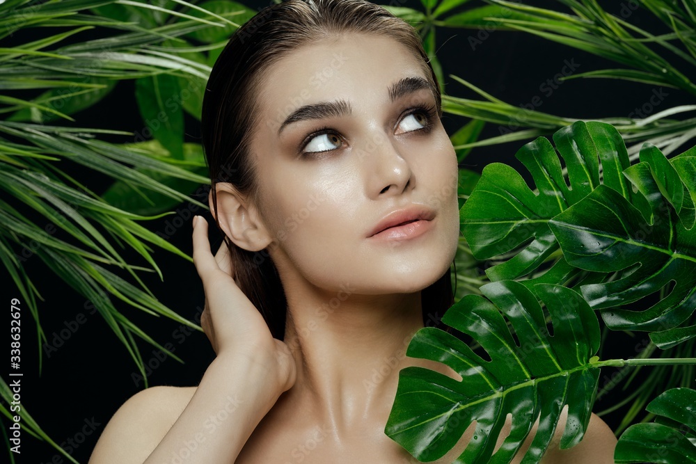 Beautiful woman green leaves exotic charm Beautiful woman green leaves exotic charm