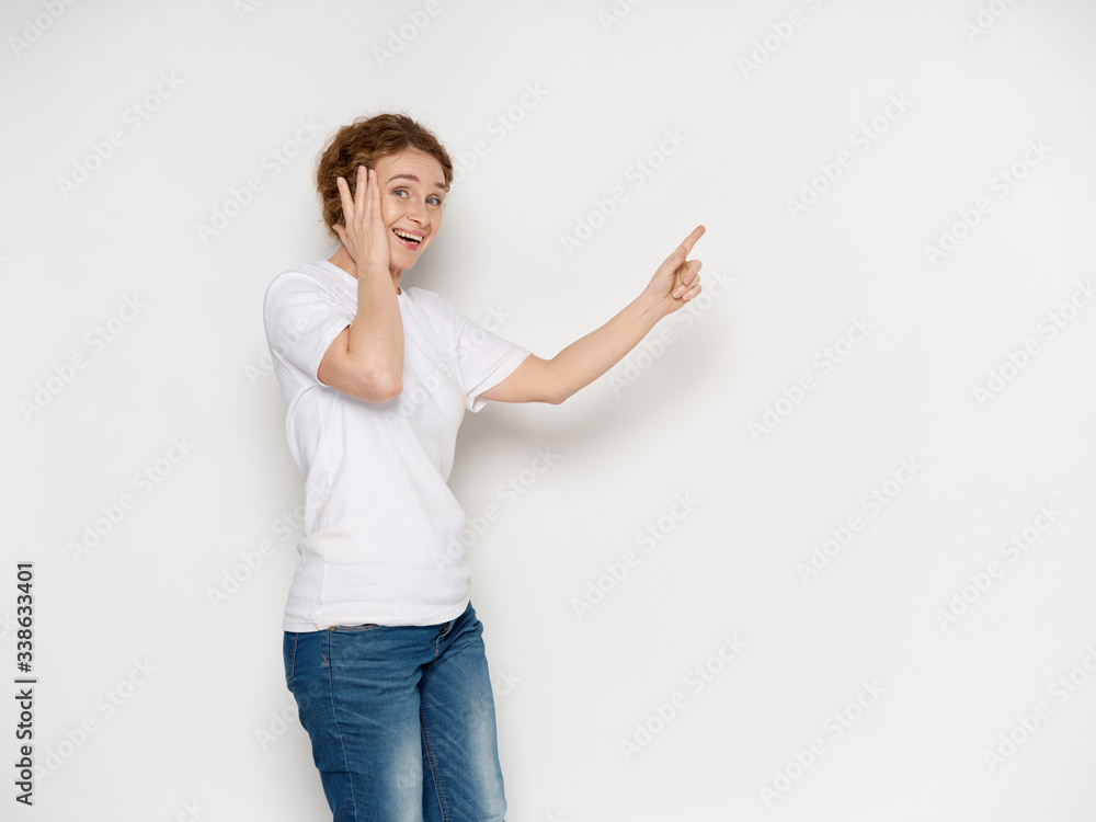 young woman pointing at something young woman pointing at something