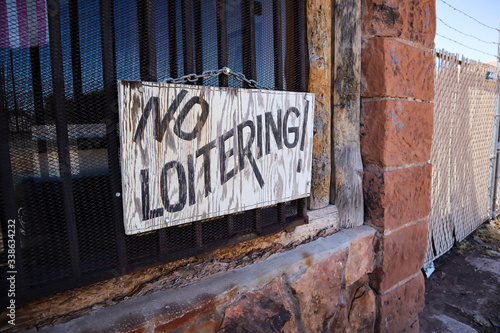Old Faded No Loitering Sign