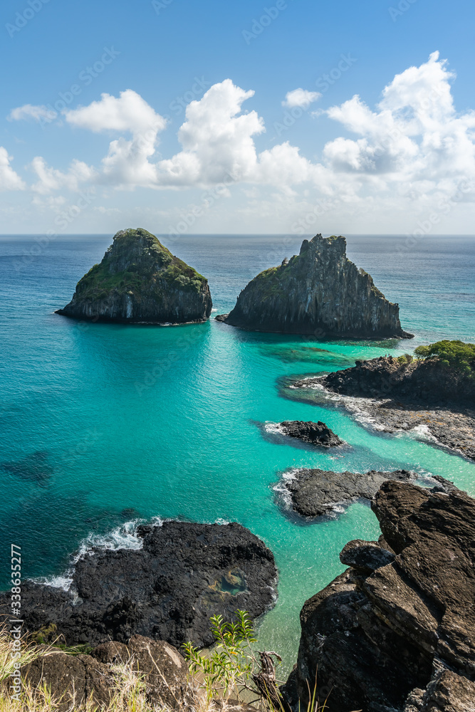 Aerial view of Dois Irmaos Hill at Baia dos Porcos beach, with turquoise clear water, at Fernando de Noronha Marine National Park, a Unesco World Heritage site, Pernambuco, Brazil