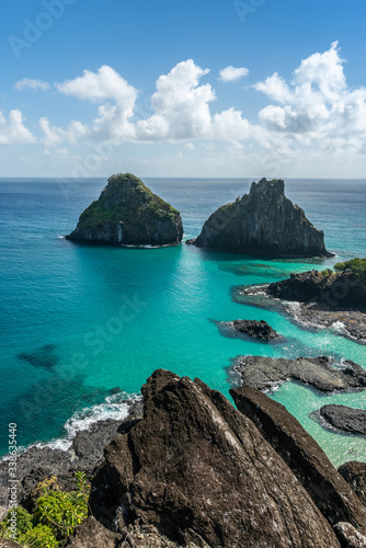 Aerial view of Dois Irmaos Hill at Baia dos Porcos beach, with turquoise clear water, at Fernando de Noronha Marine National Park, a Unesco World Heritage site, Pernambuco, Brazil