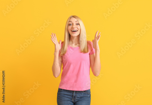 Happy woman with dental braces on color background