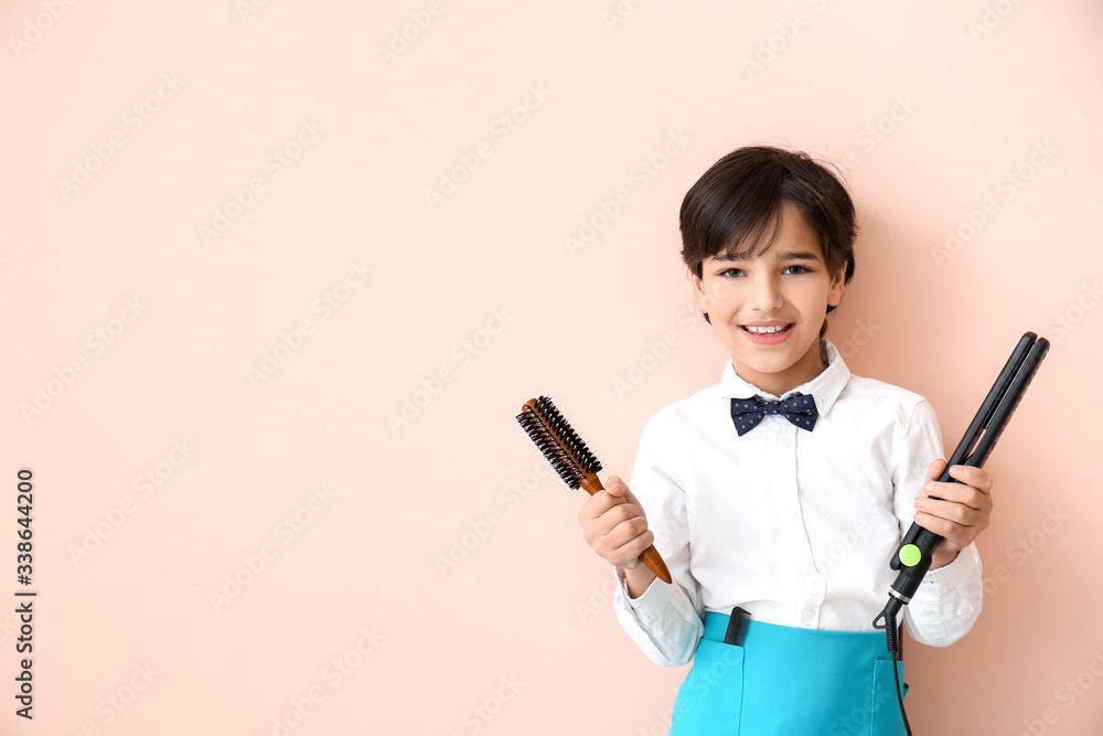 Cute little hairdresser on color background Cute little hairdresser on color background