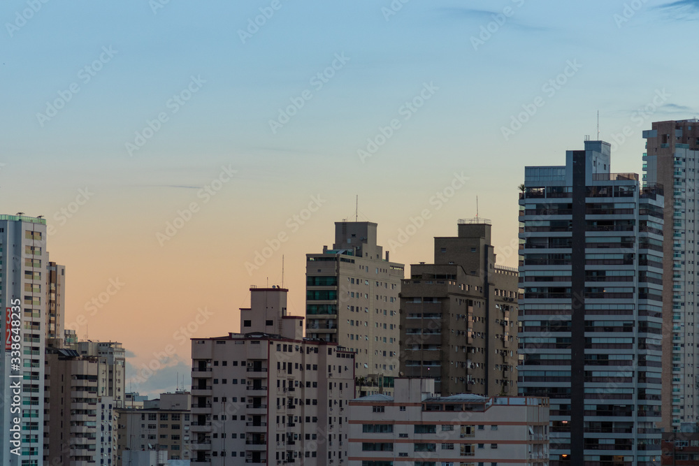 sunset in the city with buildings