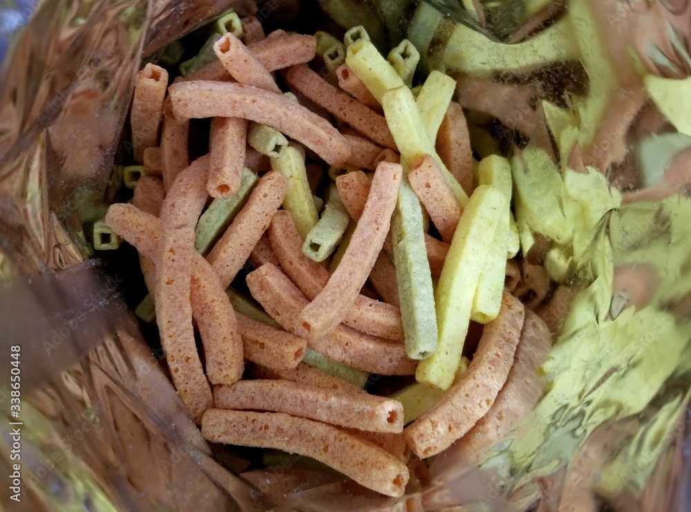 Vegetable straw chips inside the snack bag Vegetable straw chips inside the snack bag