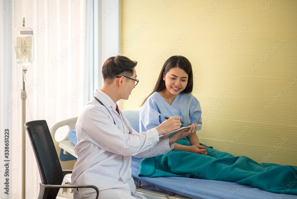 custom made wallpaper toronto digitalDoctor and patient discussing something while checking health in the bed at hospital