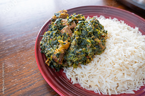 Nigerian Spicy Vegetatable soup served with Rice photo