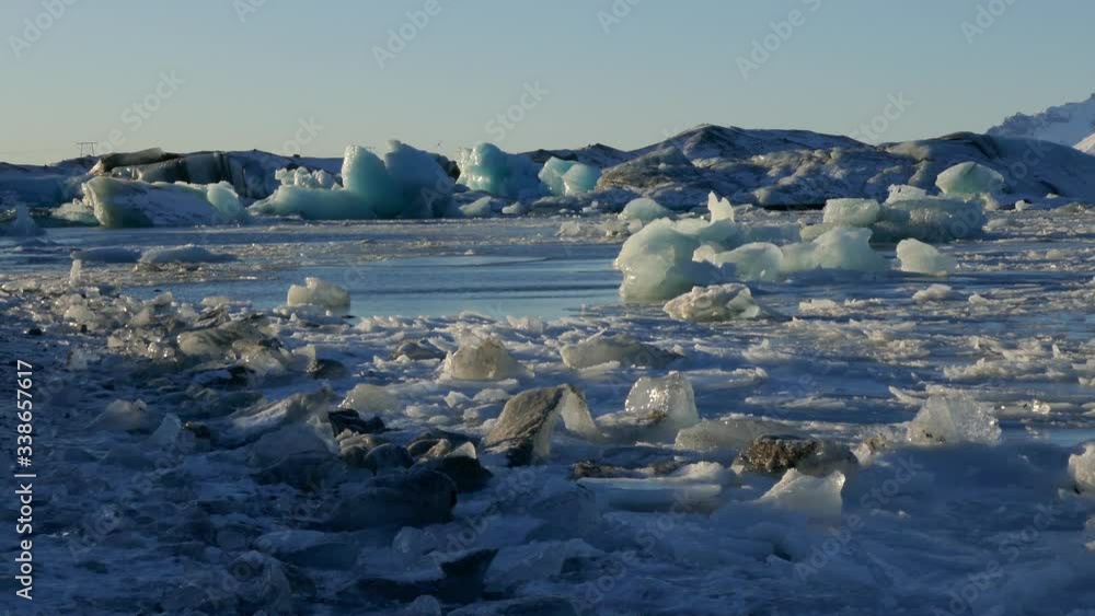 Global warming climate change iceberg floe broken from glacier melting in water Global warming climate change iceberg floe broken from glacier melting in water