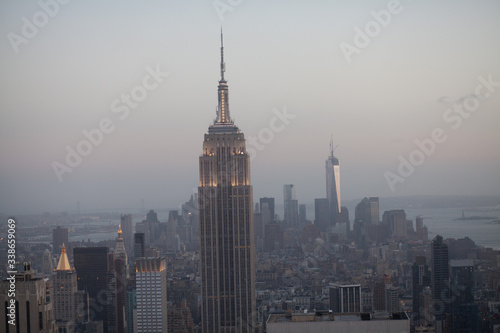фотография View Of Cityscape With Empire State Building At Dusk
