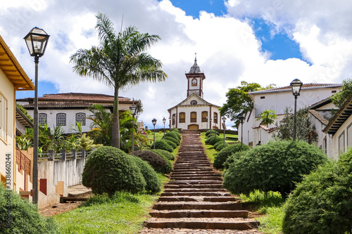 Stairway to a colonial chapel and buildings on top of a hill in historical town Serro on a sunny day  Minas Gerais  Brazil