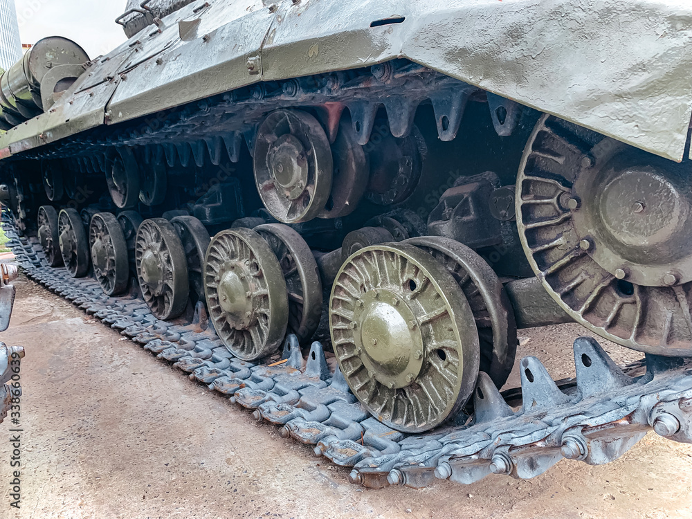 tank caterpillar in city, iron wheels, tank undercarriage close up, metal wheels concept war combat power 9 may victory day parade
