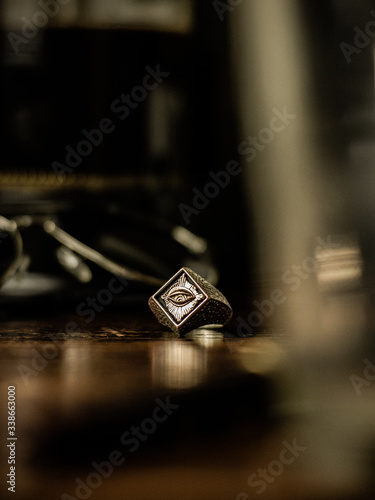 Silver Ring on Wood Table