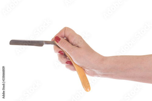 Female hand holding Vintage straight razor