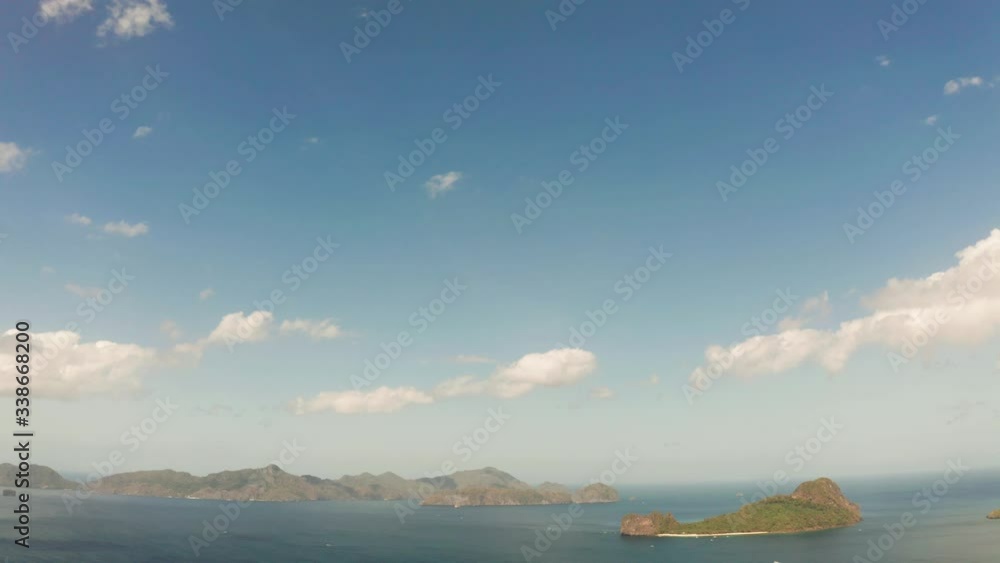 Aerial drone Seascape with tropical rocky islands, blue water. islands and mountains covered with tropical forest. El nido, Philippines, Palawan Aerial drone Seascape with tropical rocky islands, blue water. islands and mountains covered with tropical forest. El nido, Philippines, Palawan