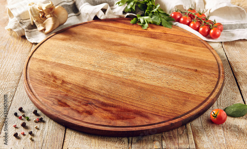 Cutting board on wooden surface