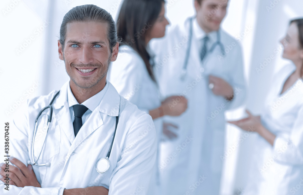 smiling doctor therapist on blurred background. smiling doctor therapist on blurred background.