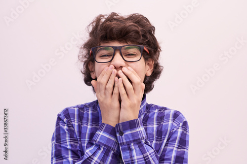 portrait  of smart looking arab teenager with glasses