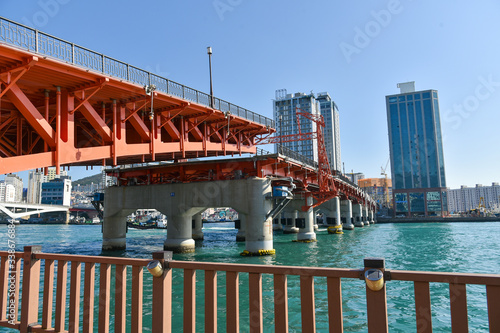 Busan city, South Korea - OCT 31, 2019: Tourists near drawbridge- Yeongdodaegyo Bridge in Jung-gu, Busan photo