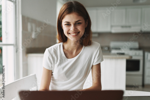 portrait of a young woman working on a laptop Free Download portrait of a young woman working on a laptop - GFXLoad