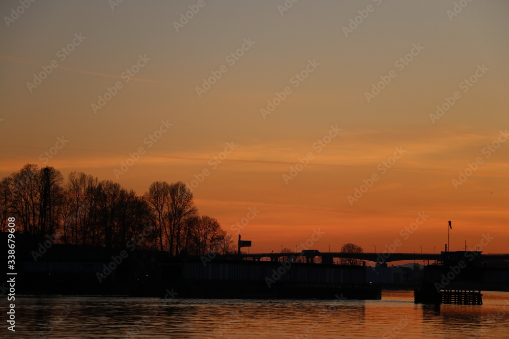 Sunset over train bridge dark orange