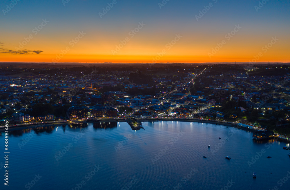 Aerial night view of Puerto Varas city just after sunset, in the Los Lagos district of Chile