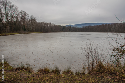Slivniski ribniki  a small lake close to Maribor  Slovenia  covered with thin ice on a cold day. Dangerous walking on the ice as it is very thin.