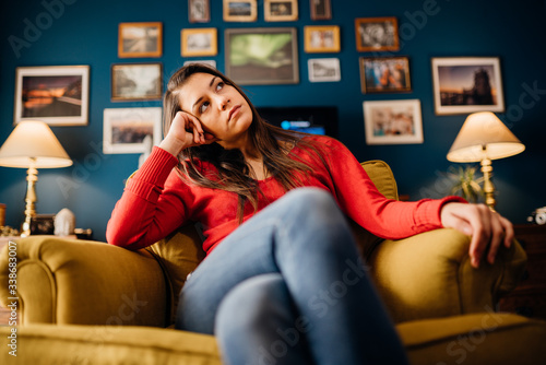 Slika na platnu Stressed woman overthinking events alone at home