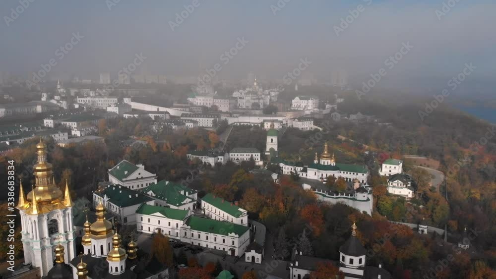 Beautiful, morning flight in the fog over the Kiev Pechersk Lavra. Autumn in Kiev. Yellow, red trees. Beautiful, morning flight in the fog over the Kiev Pechersk Lavra. Autumn in Kiev. Yellow, red trees.