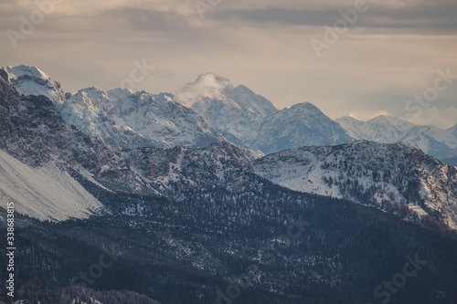 Snowy mountains around Cortina d'Ampezzo, Italy. View of the high peaks in dolomites on a cloudy day.