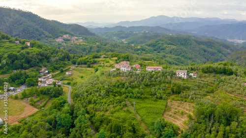 Italy. Forest covered mountains and villas. The territory of Pignone in the region of Liguria, in the province of La Spezia, Aerial View photo