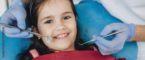 Photography Close up portrait of a caucasian girl having an examination at the pediatric den
