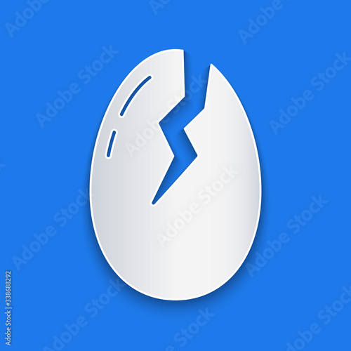 Paper cut Broken egg icon isolated on blue background. Happy Easter. Paper art style. Vector Illustration