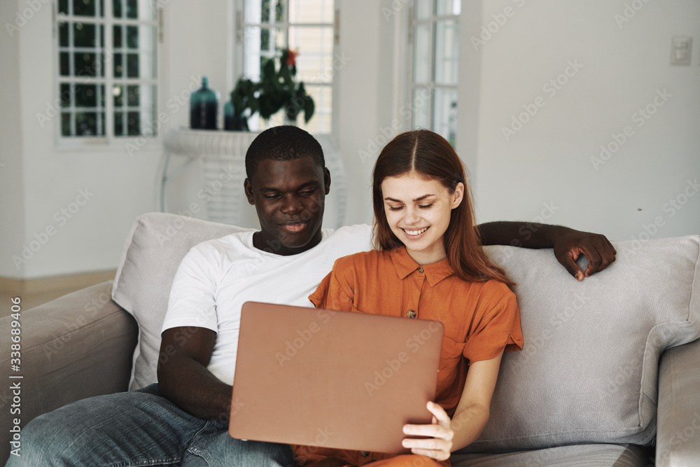 happy couple using laptop happy couple using laptop