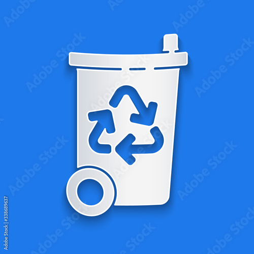 Paper cut Recycle bin with recycle symbol icon isolated on blue background. Trash can icon. Garbage bin sign. Recycle basket sign. Paper art style. Vector Illustration
