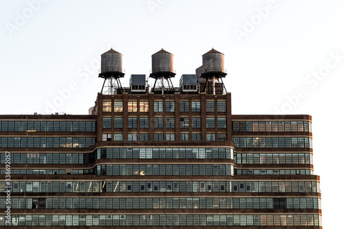 Photography New york city old building with 3 reservoirs on the top