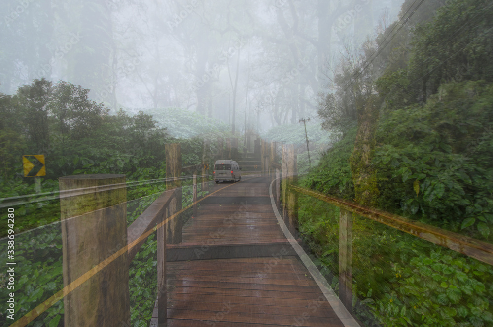 Van on the road and wooden bridge into the forest Van on the road and wooden bridge into the forest