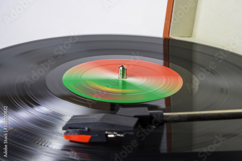 Closeup of a vinyl record spinning on a turntable
