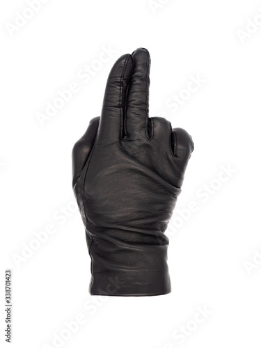Isolated woman's hand wearing a black leather glove palm down, index and second finger together and pointing, ring and little finger bent. Thumb tucked in