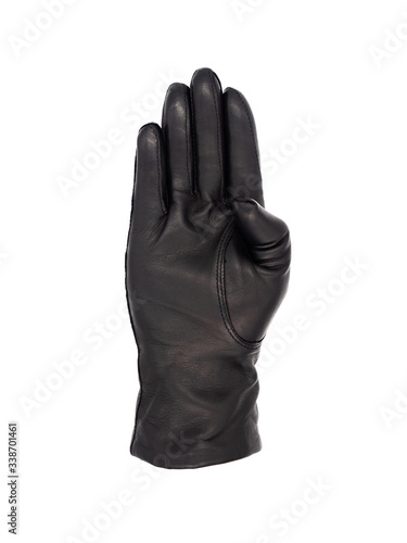 Isolated woman's hand wearing a black leather glove palm up fingers together thumb tucked in